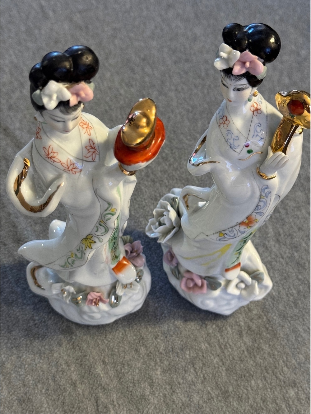Pair of porcelain lady figurines white robes with gold accents